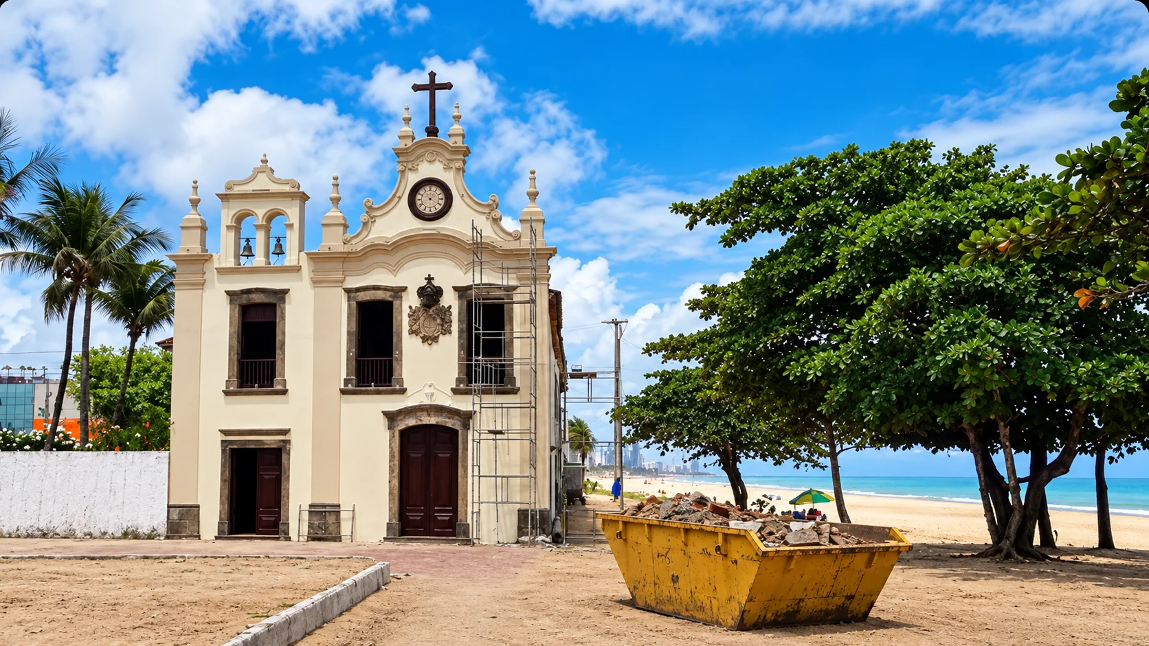 Caçamba amarela cheia de entulho ao lado de uma igreja histórica, com a praia e prédios da orla ao fundo